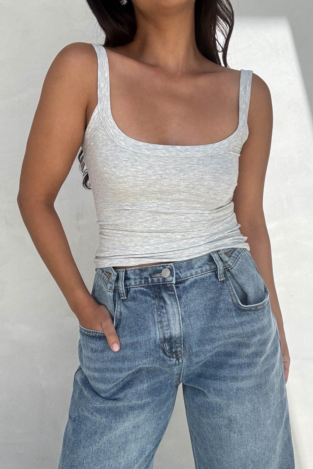 An Effortless And Essential Scoop Neck Tank Top Crafted From An Ultra-Soft Viscose-Spandex Blend That Gently Hugs Your Curves. Featuring A Classic Ribbed Texture Look And Wide Shoulder Straps, This Premium Basic Top Provides A Flattering, Form-Fitting Silhouette With Ultimate Breathability. Pair It Casually With Your Favorite High-Waisted Denim For A Timeless Everyday Style, Or Layer It Under A Tailored Blazer For A Chic, Contemporary Ensemble. – Classic Sleeveless Tank Top Silhouette With A Flattering Scoop Neckline – Ultra-Soft, Lightweight, And Breathable Construction Ideal For All-Day Wear – Minimalist Everyday Basic Design That Serves As An Essential Layering Piece – Versatile Casual Style That Pairs Perfectly With Denim, Skirts, Or Loungewear Fabric Content: (Z8101T) image