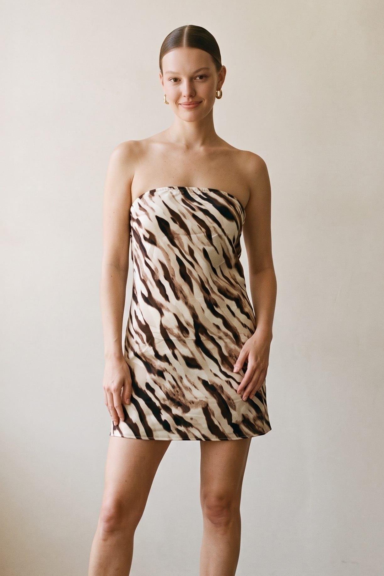 A Strapless Mini Dress Featuring An Eye-Catching Abstract Animal Print For A Bo (Open) image