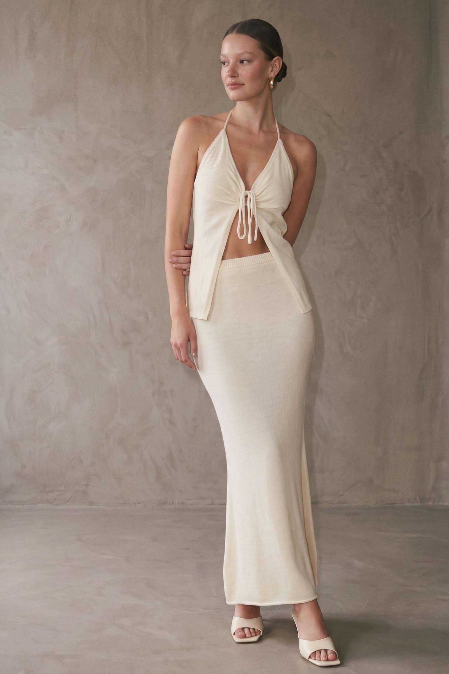 A Knit Two-Piece Set Featuring A Halter Top With A Front Tie Knot Detail And Cro (Bust) image