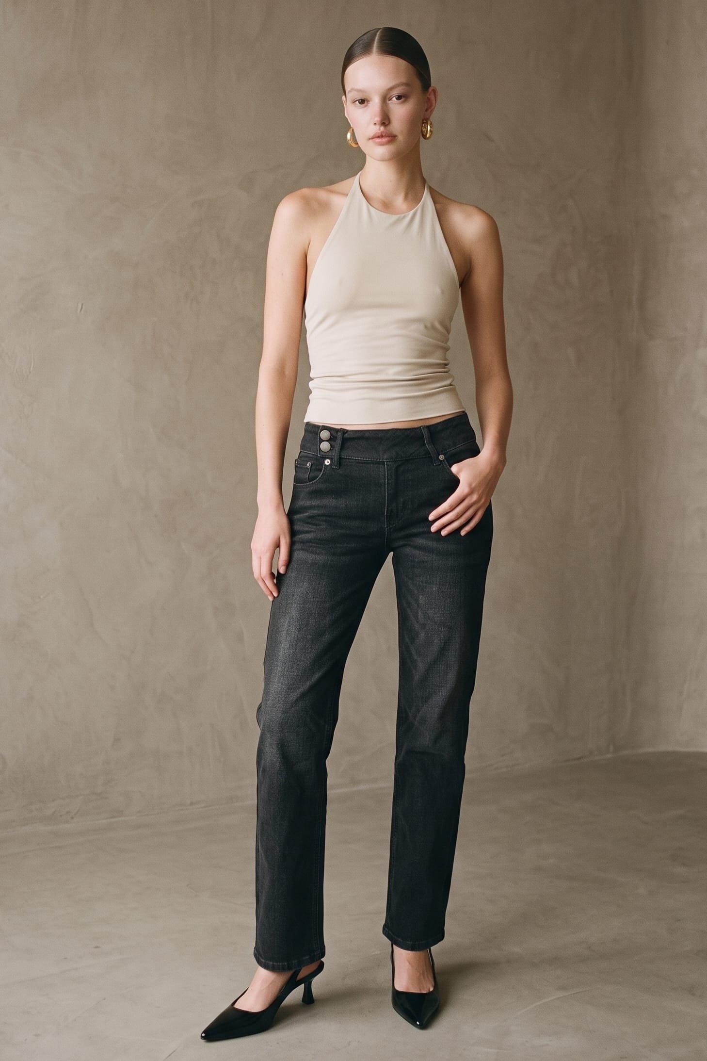 A Classic Washed Black Denim Pant Featuring A Low Rise Fit And A Decorative Belt (Low) image