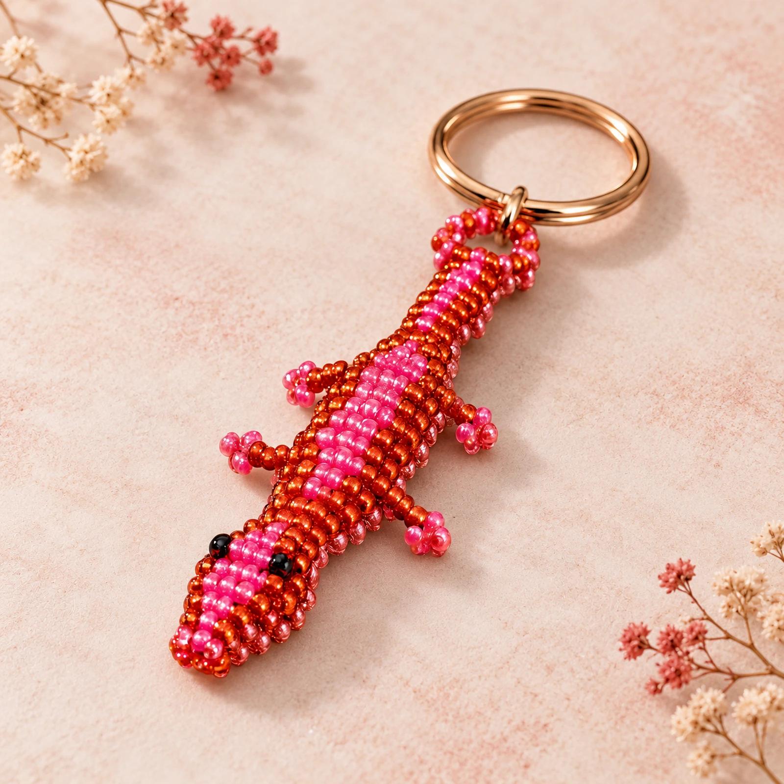 Red and pink beaded gecko keychain image