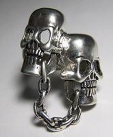 CHAINDED TOGETHER SKULL HEADS BIKER RING image