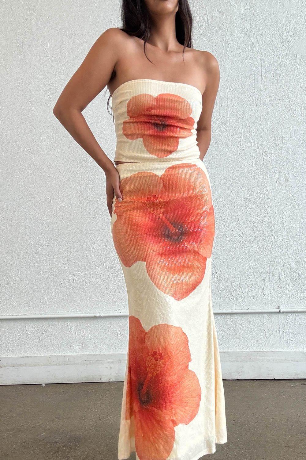 A Stunning Strapless Crop Top Featuring An Oversized Hibiscus Floral Print On A Soft Sequin Knit Fabric. The Bold Placement Print, Stretchy Construction, And Clean Straight Neckline Make It An Effortless Statement Piece — Perfect For Pairing With The Matching S8083S Floral Sequin Maxi Skirt. – Strapless Straight Neckline – Oversized Hibiscus Floral Placement Print – Sequin Knit Fabric With Stretch – Pairs With S8083S Floral Sequin Maxi Skirt Fabric Content: (S7903T) image
