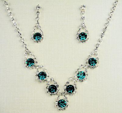 Green CZ necklace and earring set. image