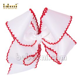 White bow with thread zigzag