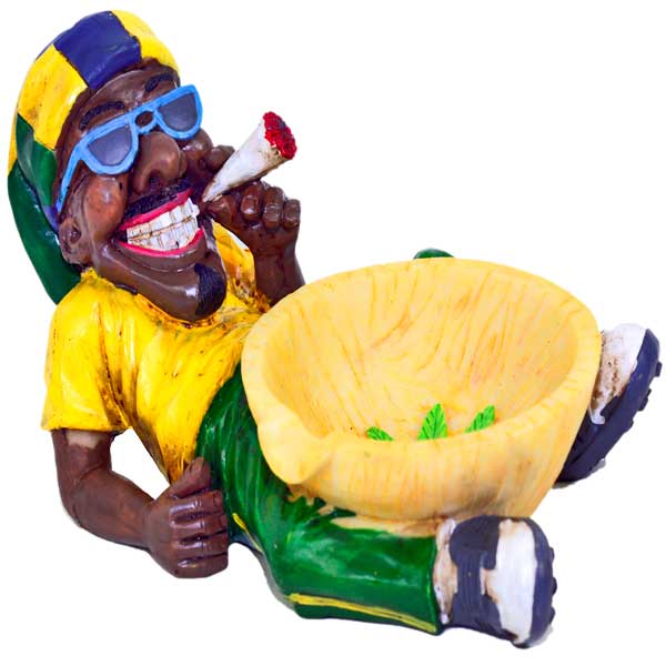 JAMAICAN MAN HOLDING ASHTRAY